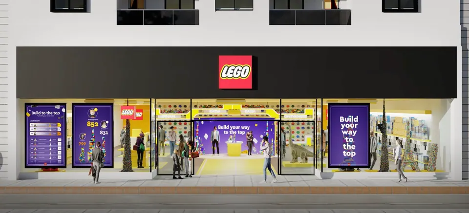 LEGO store front with 'Build your way to the top' screens